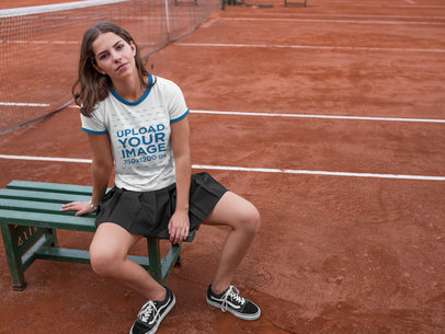 Pretty Woman Wearing a Ringer Tshirt Mockup While at the Tennis Court