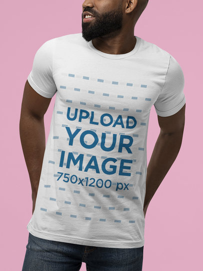 T-Shirt Mockup Featuring a Bearded Man Posing in a Studio