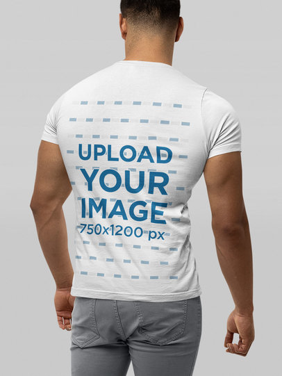 Back-View T-Shirt Mockup of a Muscular Man Standing in a Studio