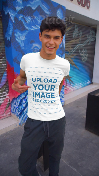 T-Shirt Video Featuring a Young Man Walking in the City 