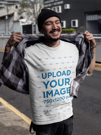 Smiling Tattooed Asian Man Wearing a Round Neck T-Shirt Mockup Outdoors