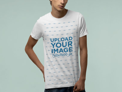 Bella Canvas T-Shirt Mockup Featuring a Man Posing at a Studio
