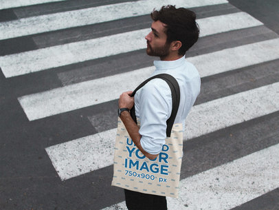 Man Crossing the Street While Carrying a Tote Bag Mockup