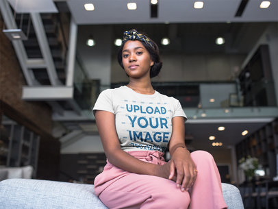 Pretty Woman Wearing a T-Shirt Mockup While at a Penthouse Living Room