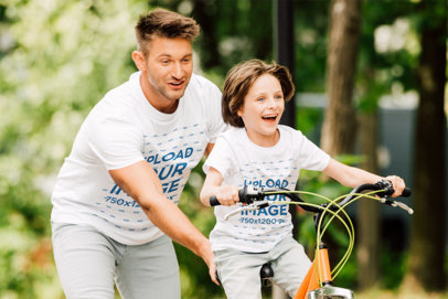 T-Shirt Mockup Featuring a Dad Teaching His Son How to Ride a Bike