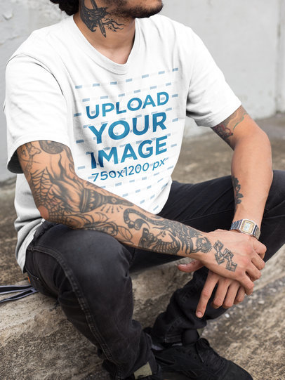 Closeup of a Hispanic Tattooed Man Wearing a T-Shirt Mockup While Sitting Down