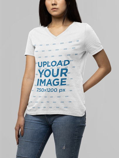 Mockup of a Serious Woman Wearing a Bella Canvas V-Neck T-Shirt 