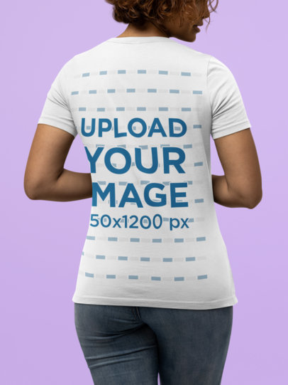 Mockup of the Back of a Woman Wearing a Bella Canvas Tee in a Studio