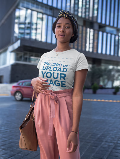 Woman Wearing a Round Neck T-Shirt Mockup in the City
