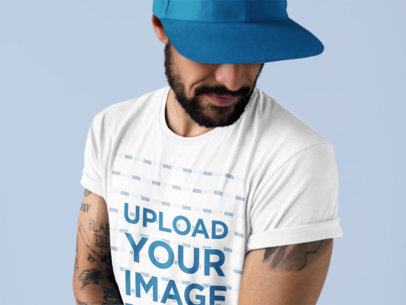 Closeup of a Tattooed Man Wearing a Round Neck Tee Mockup at a Studio