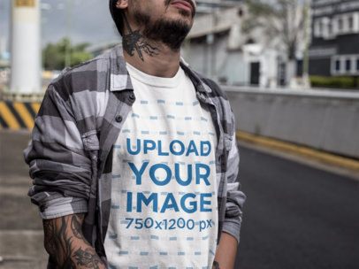 Cropped Face Urban Man Wearing a Round Neck Tee Mockup While at the Street