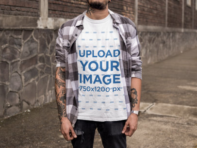 Tattooed Man at a Dangerous Neighborhood Wearing a Round Neck T-Shirt Mockup 