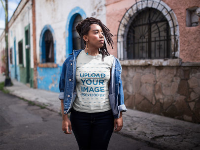 Dreadlocked Woman Wearing a T-Shirt Mockup While Walking in the Street