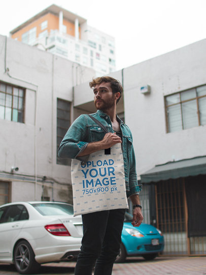 Man Wearing Carrying a Tote Bag Mockup While Outdoors