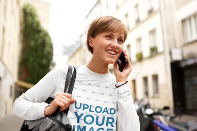 Sweatshirt Mockup Featuring a Woman With Short Hair Speaking on the Phone