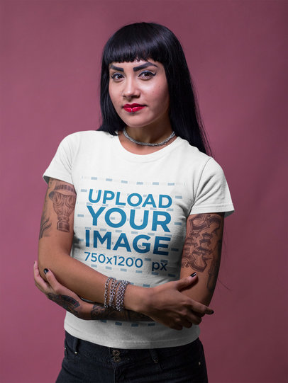 Tattooed Girl Wearing a Round Neck Tee Template While Standing Against a Pink Backdrop a17147