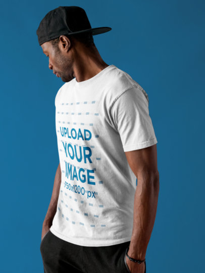 Dude Wearing a Round Neck Tee Mockup While Against a Solid Backdrop