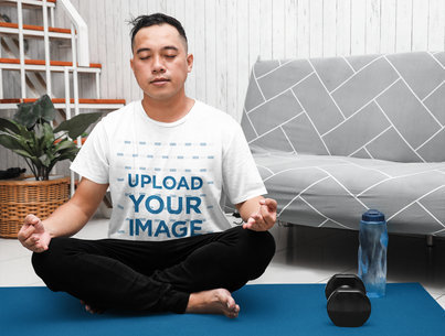 T-Shirt Mockup of a Man Meditating After Working Out at Home