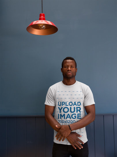 Man Wearing a Round Neck Tee Template While Under a Red Lamp