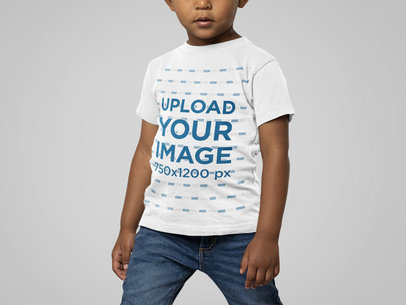 Bella Canvas Tee Mockup Featuring a Kid Standing in a Studio