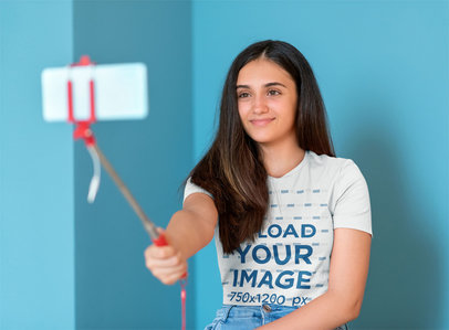 Basic Tee Mockup Featuring a Teenager Taking a Selfie
