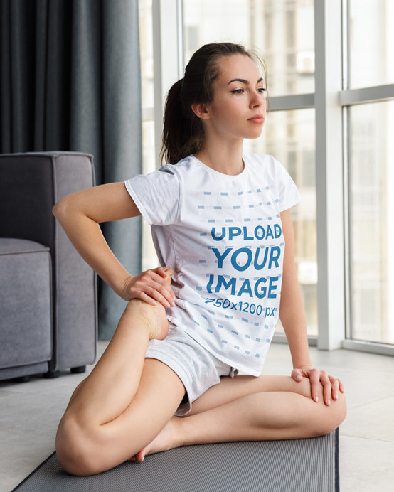 T-Shirt Mockup of a Woman Stretching Her Leg While Doing Yoga