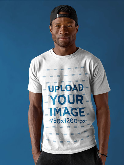 Smiling Dude Wearing a Round Neck Tee Template Against a Blue Background