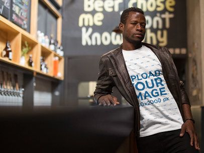 Guy Wearing a Round Neck Tee Mockup While Waiting for a Drink at a Bar