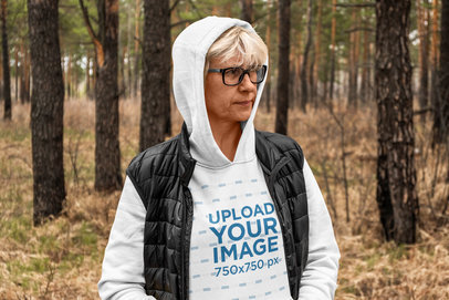 Hoodie Mockup Featuring a Middle-Aged Woman in the Woods m15701-r-el2