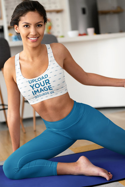 Sports Bra Mockup Featuring a Smiling Woman Doing Yoga at Home
