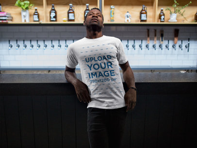 Mockup of a Man Wearing a Round Neck Tee While at a Tap Bar