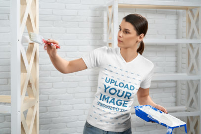 V-Neck Tee Mockup of a Woman Painting Some Furniture