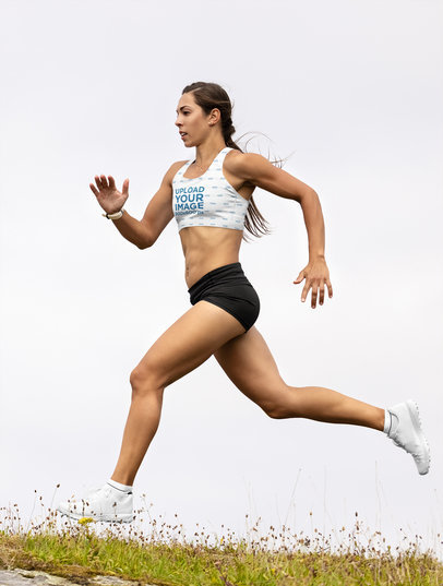Sports Bra Mockup of a Young Woman Running in the Outdoors