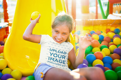 T-Shirt Mockup of a Happy Girl Playing in a Ball Pit m17133-r-el2