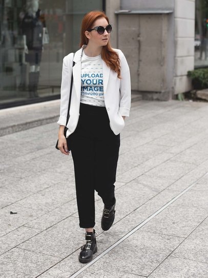 Mockup of a Fashion Woman Wearing a Tee Mockup Walking in the City