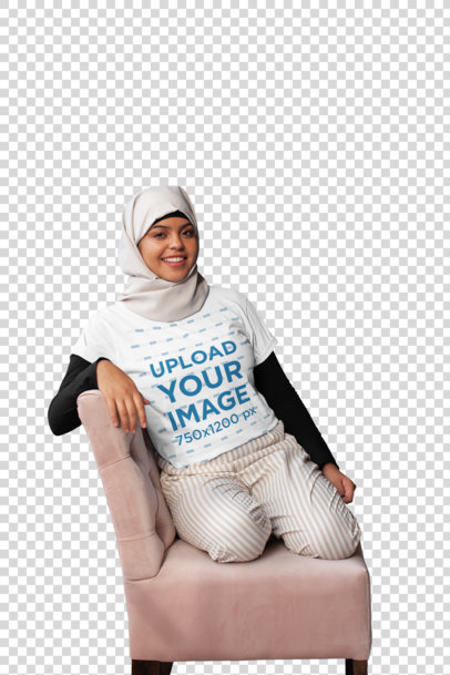 Transparent T-Shirt Mockup of a Woman Wearing a Hijab Casually Sitting on a Couch 28399