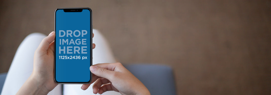 iPhone 11 Pro Mockup Being Held by a Woman in her Living Room