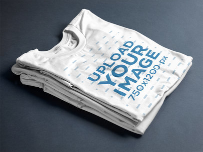 T-Shirt Mockup Folded Over Two Tees on a Table