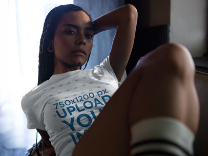 Woman Doing a Sexy Pose While Wearing a Round Neck Tee Mockup Indoors