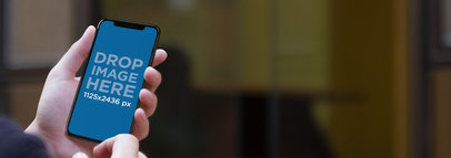 iPhone 11 Pro Mockup Being Held by a Businesswoman Outside the Office