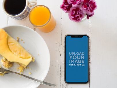 iPhone X Mockup Lying Next to a Cheescake Plate a17311