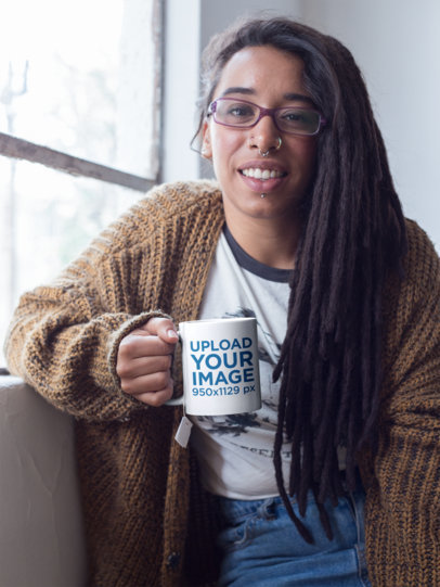 Mug Mockup Held by a Smiling Woman with Locs Having a Coffee