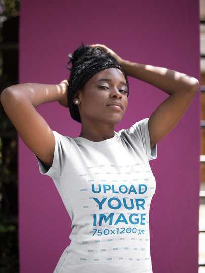 Woman Wearing a T-Shirt Mockup while Standing Against a Pink Wall