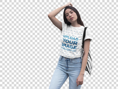 Transparent Mockup of a Serious Woman Wearing a Tshirt Standing Against Urban Art