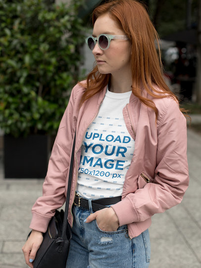 Fashion Woman Wearing a T-Shirt Mockup While in the Street