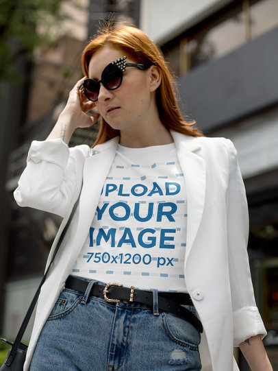 Fashioned Woman Wearing a T-Shirt Mockup While Walking in Daylight