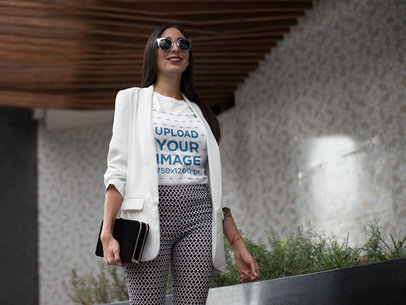 Woman Wearing a T-Shirt Mockup While Walking at the Mall