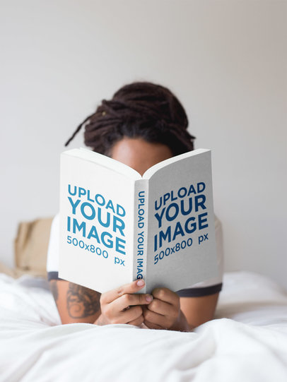 Girl with Dreadlocks Reading a Book Mockup While in Bed a17301