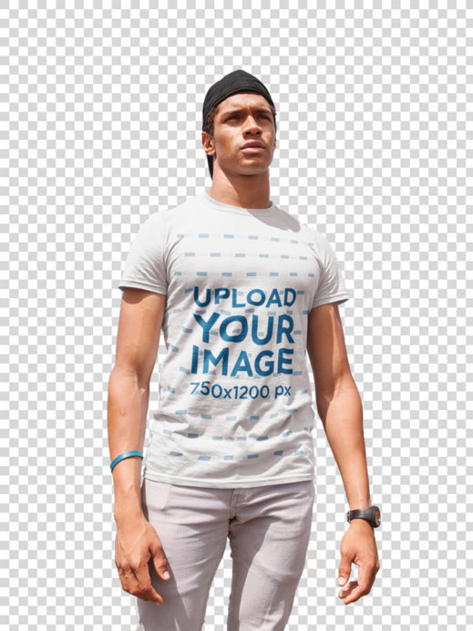 Transparent Mockup of a Young Man Wearing a Tshirt by a Palm Tree at a Parking Lot