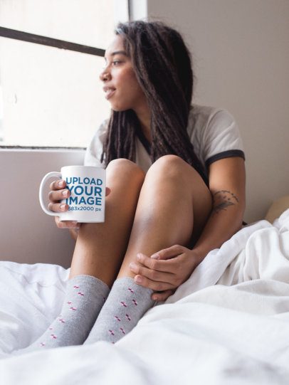 Mockup of a Womanl on the Bed Holding a Coffee Mug While Looking Through the Window 17303